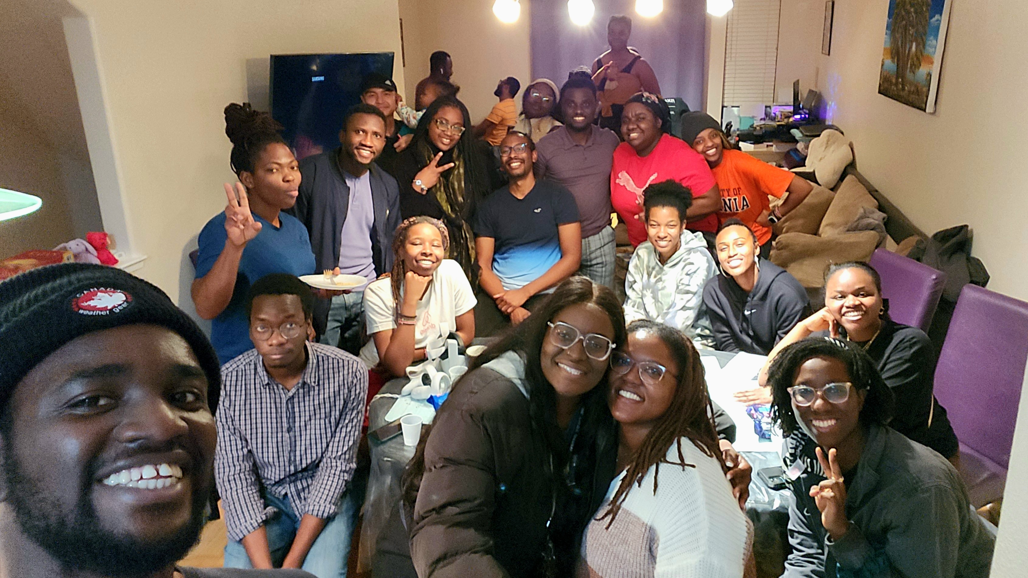 Group of Black UC Davis students gather in Doreen Joseph's living room for game night.