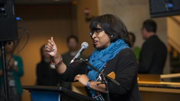 Renetta Garrison Tull speaking at podium