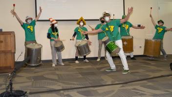 Brian Rice thanks the crowd for attending his Samba group's musical performance