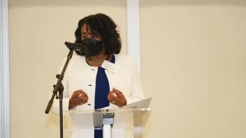 Renetta Tull at podium delivering remarks