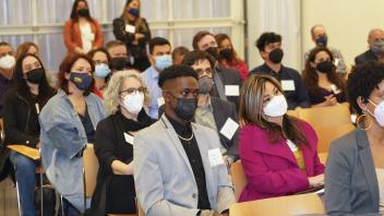 audience listens to remarks