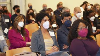audience listens to remarks