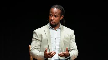Kendi listens to panel question