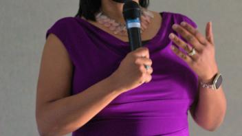 Renetta Tull speaking into a microphone.