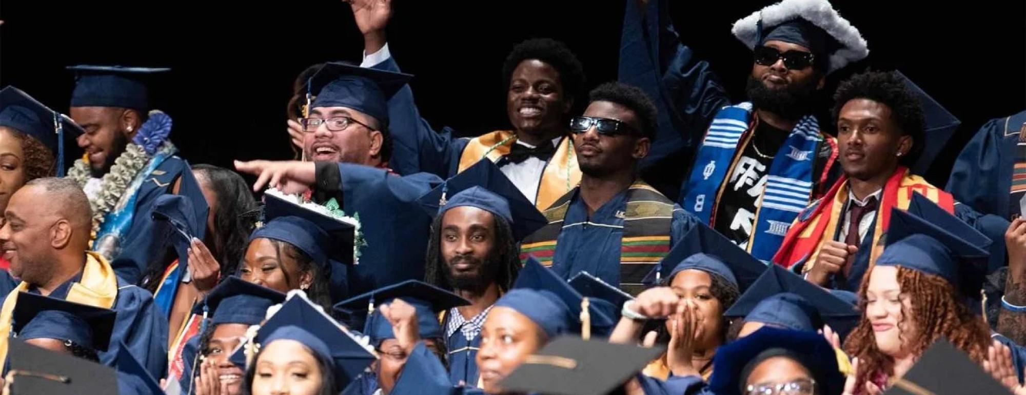 Group of students at black graduation ceremony.