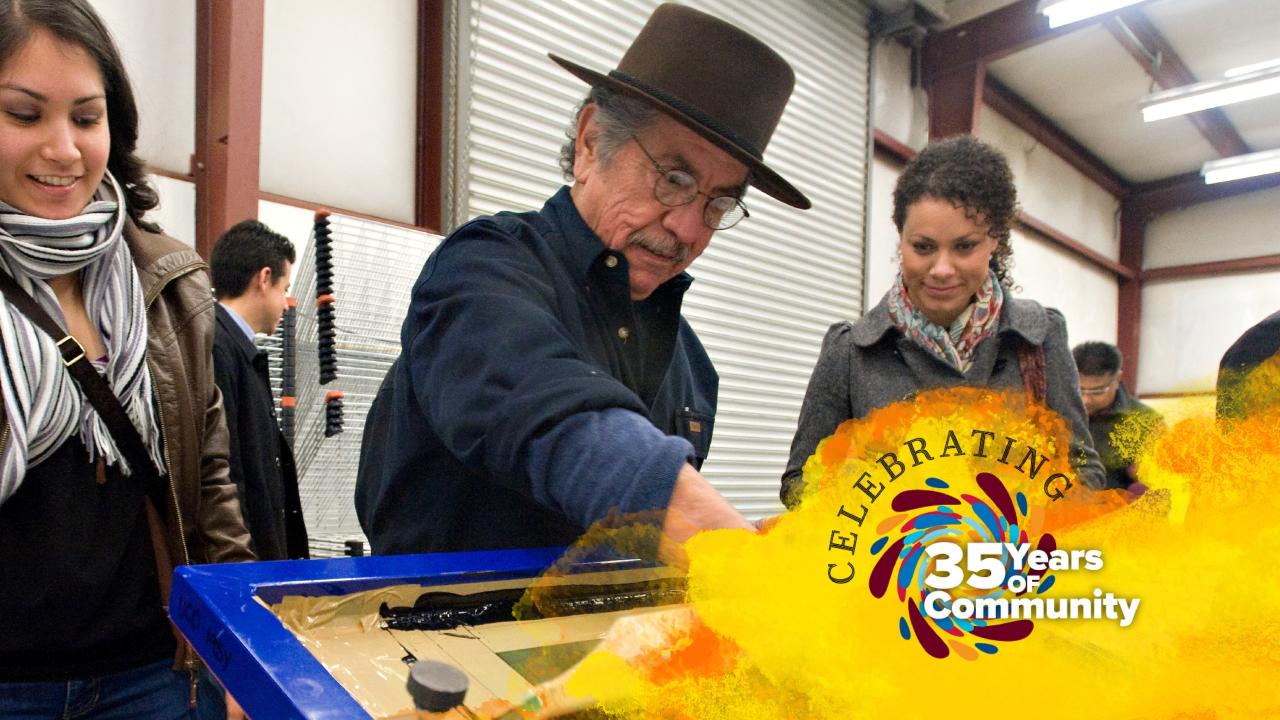 Group of people in a workshop setting engaging in an activity, the words "Celebrating" with a colorful "35 Years of Community" graphic overlay. 