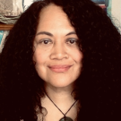 Portrait of a woman with long black hair