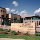 Exterior view of the UC Davis MIND Institute with modern architecture.