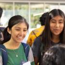 Latinx college-aged students smiling, gathered together